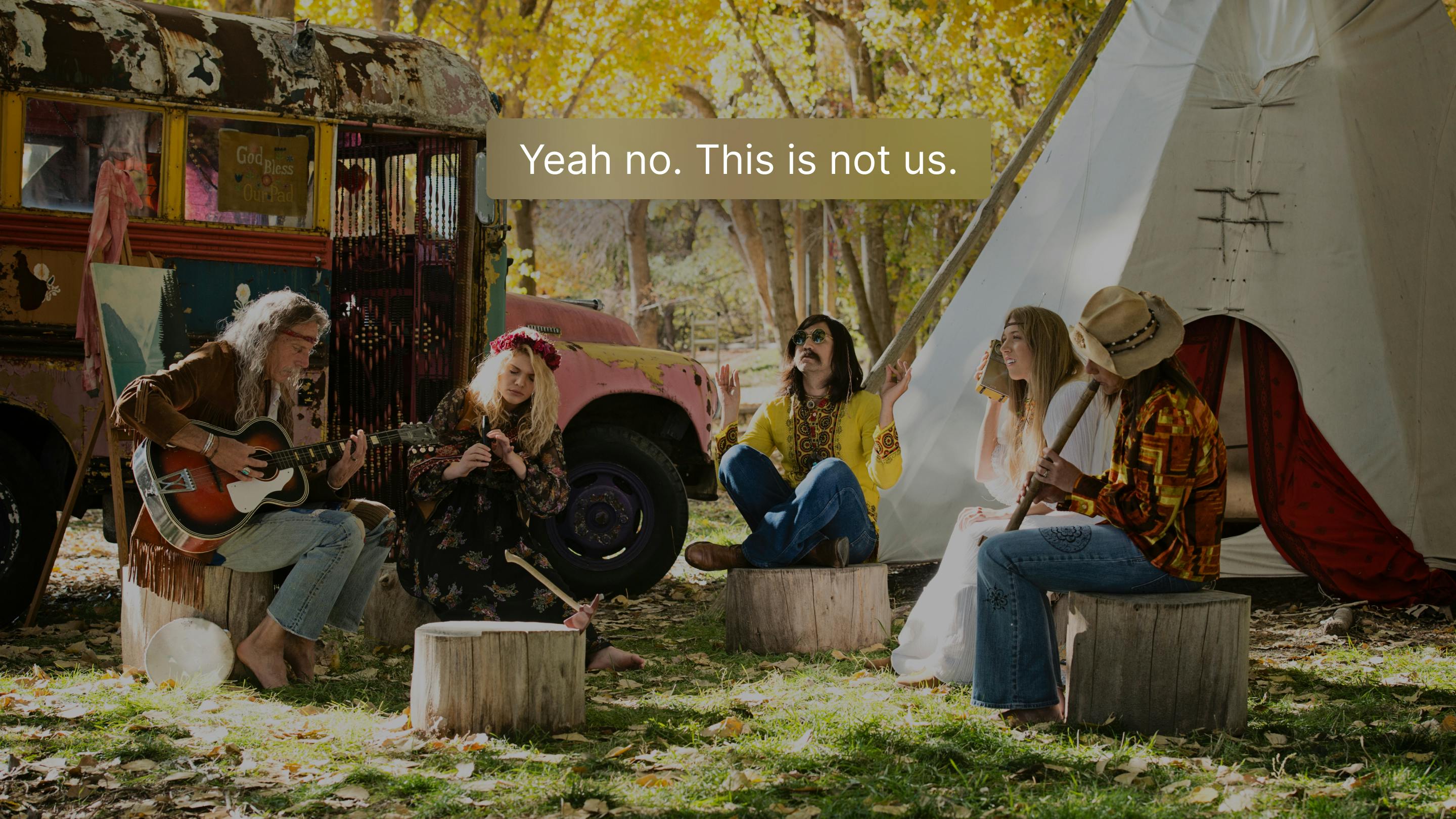 Image of a group of hippies with a note overlaid saying 'Yeah no, this is not us'